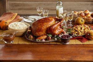 Thanksgiving Dinner Table with a turkey and sides