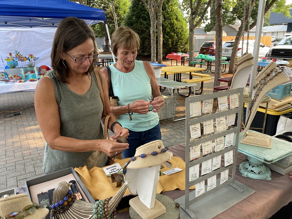 two women at a booth at the 2021 Washougal Art Festival