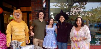 a large group of people dressed up as characters from Wizard of Oz for trick or treating in Camas