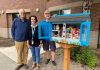 Bob Chapman, Shanna Baird, and Duane Sich standing by a Little Food Pantry food bank in Vancouver