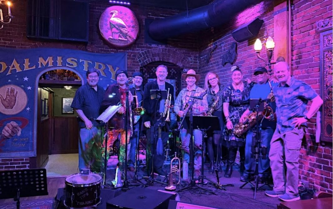 One Eye Kats musical group playing at a concert
