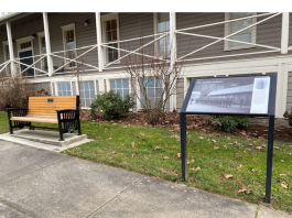 memorial bench for Willie Morehouse, a Black veteran of the U.S. Army who served at Fort Vancouver in the 1940s., outside a building