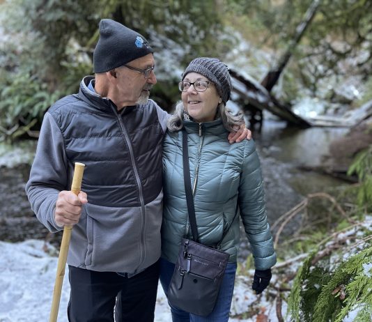 Szue and Frank Juhasz hiking in the snow in the Olympic Peninsula