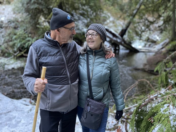 Szue and Frank Juhasz hiking in the snow in the Olympic Peninsula